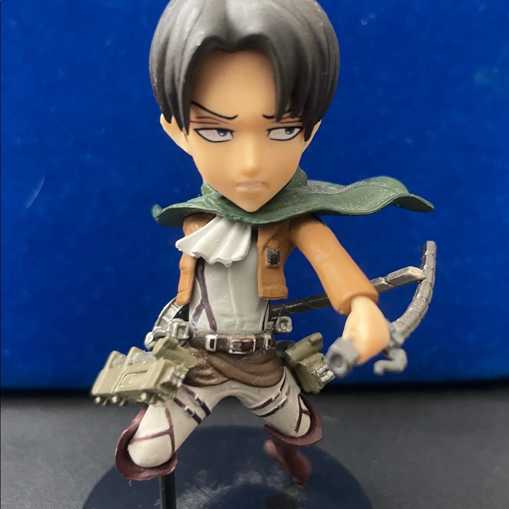 Anime Character Figure with Green Cape